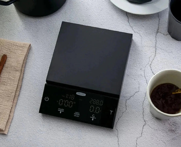 Kaffiswaag - Barista an Espresso
